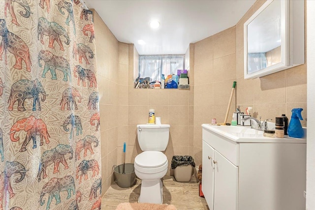 bathroom featuring toilet, tile walls, a shower with curtain, and vanity