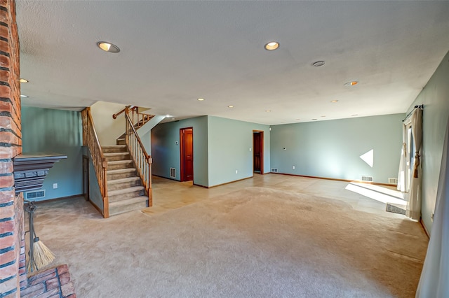 unfurnished living room featuring light colored carpet