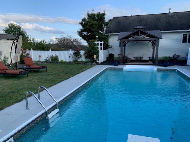 view of pool with a lawn and a gazebo