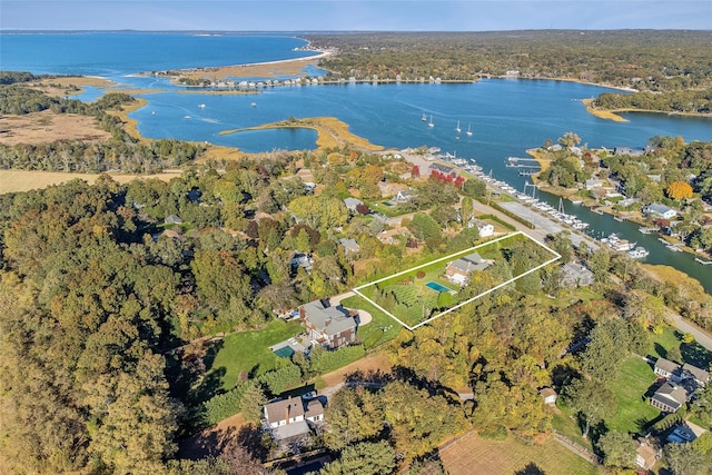 birds eye view of property with a water view