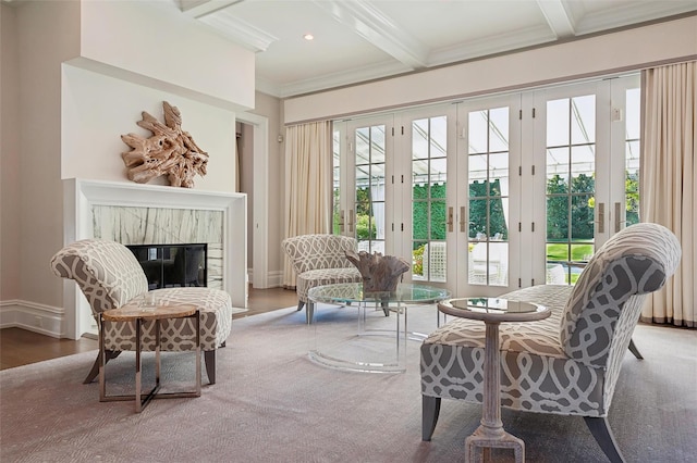 interior space with a high end fireplace, french doors, beamed ceiling, and coffered ceiling