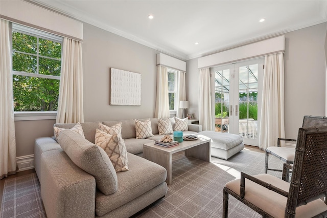 sitting room with a wealth of natural light and ornamental molding