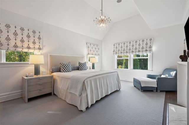 bedroom featuring a chandelier and lofted ceiling