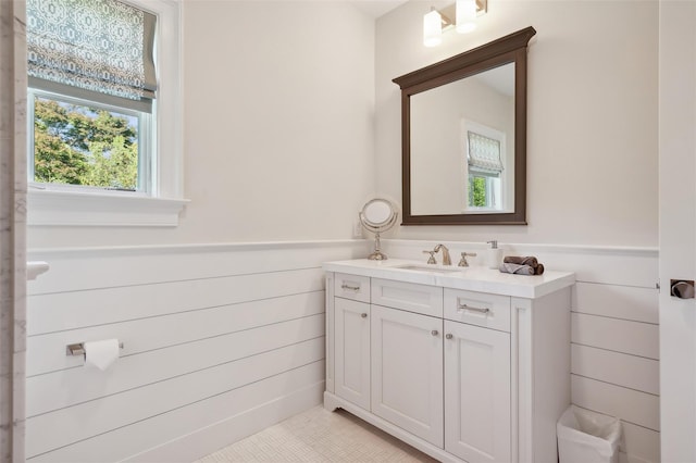 bathroom with tile patterned flooring and vanity