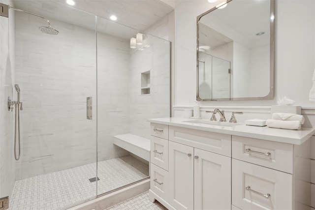 bathroom with tile patterned flooring, vanity, and an enclosed shower