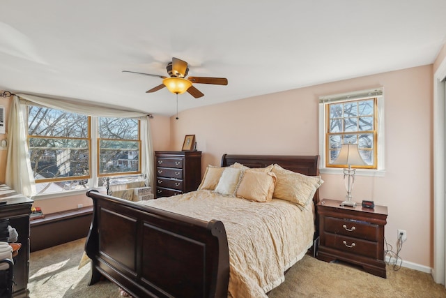 bedroom with light carpet and ceiling fan