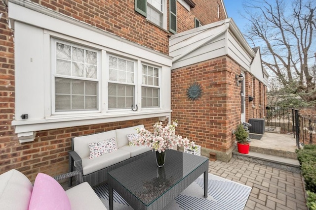 view of patio / terrace with central AC and an outdoor living space