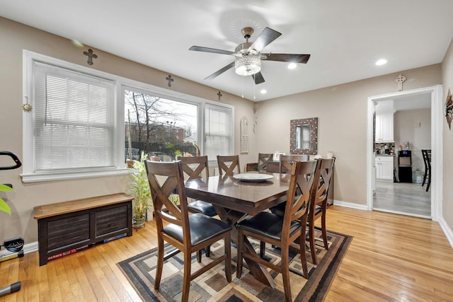 dining area featuring ceiling fan and light hardwood / wood-style flooring