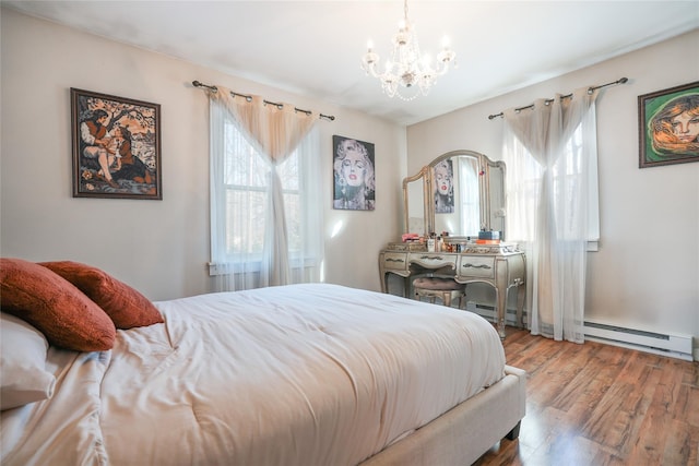 bedroom featuring baseboard heating, hardwood / wood-style floors, and a notable chandelier