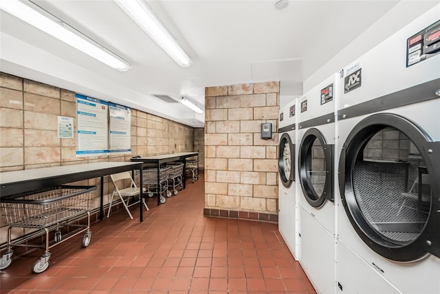 clothes washing area with washing machine and clothes dryer