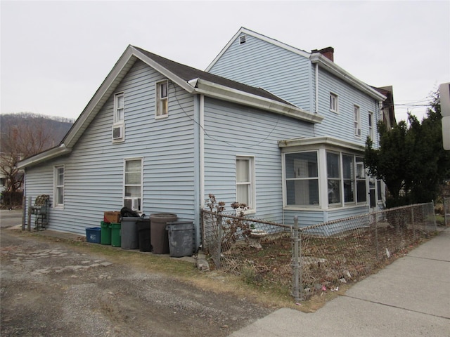 view of side of home with a sunroom