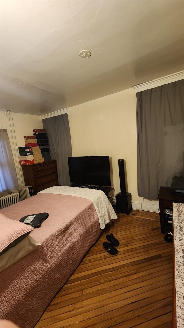 bedroom featuring dark wood-style floors