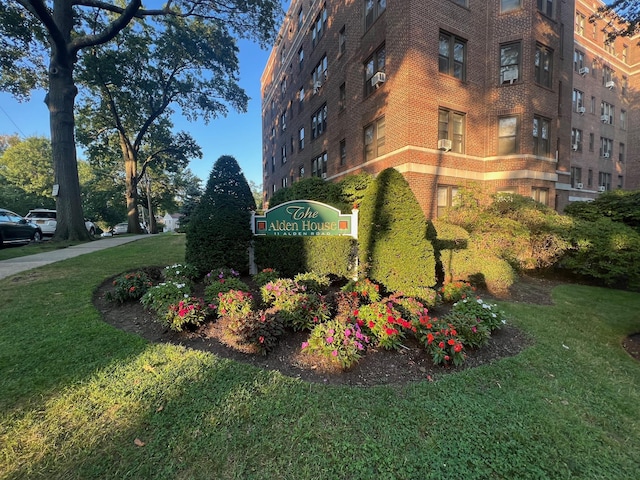 community / neighborhood sign with a lawn