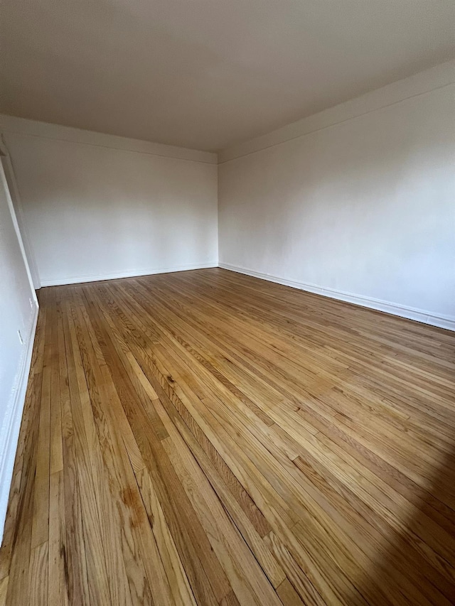 unfurnished room with light hardwood / wood-style flooring