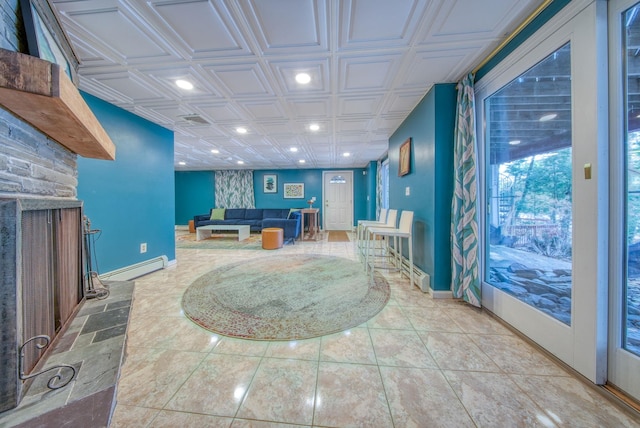 tiled living room featuring a baseboard heating unit