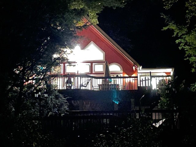 view of back house at twilight