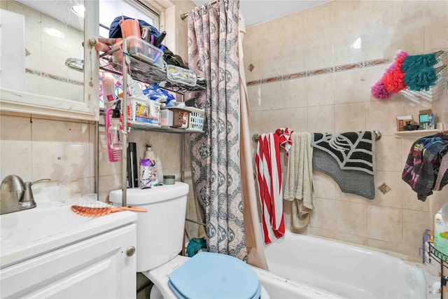 full bathroom with shower / bath combination with curtain, toilet, tile walls, and sink