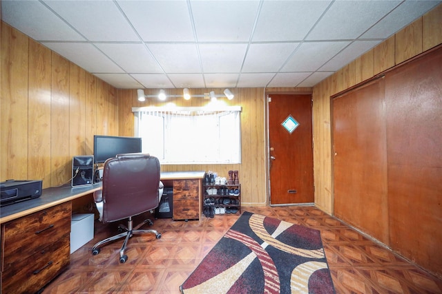 office space featuring wooden walls and parquet flooring