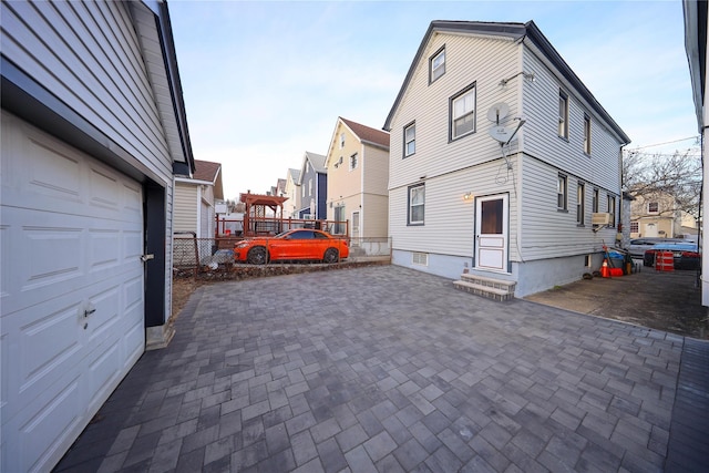 view of property exterior featuring a garage