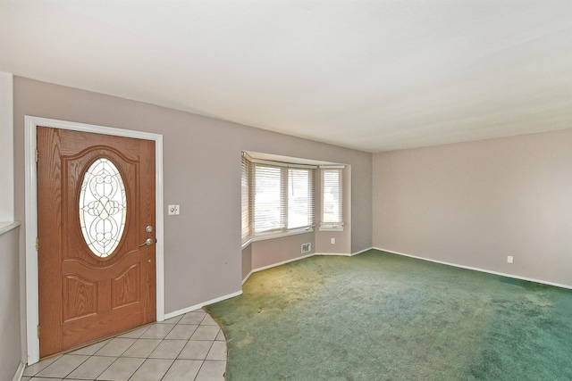 view of carpeted foyer