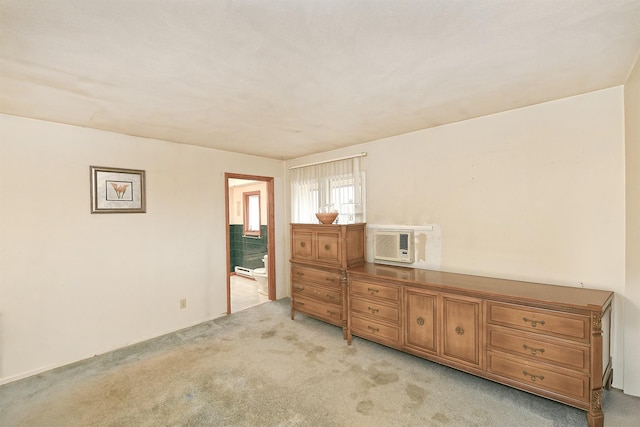 bedroom with light colored carpet and a wall mounted AC