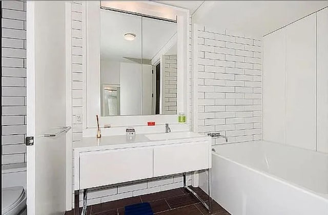 full bathroom with vanity, shower / bath combination, and toilet