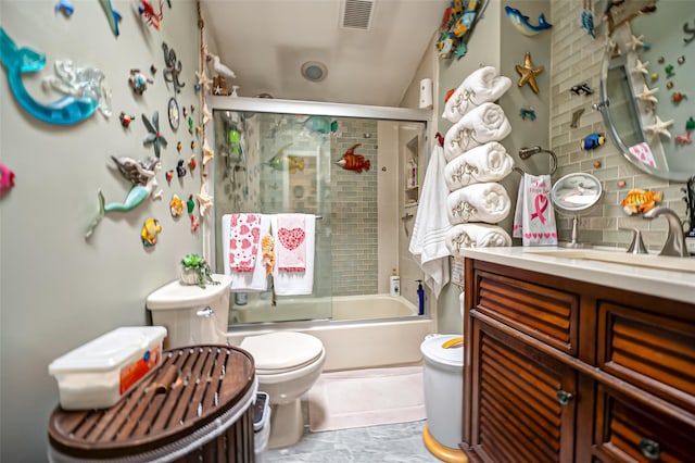 full bathroom with backsplash, bath / shower combo with glass door, toilet, and vanity