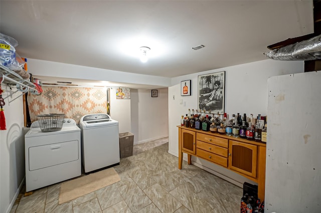 laundry room with separate washer and dryer