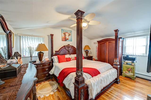 bedroom featuring ceiling fan, light wood-type flooring, multiple windows, and lofted ceiling