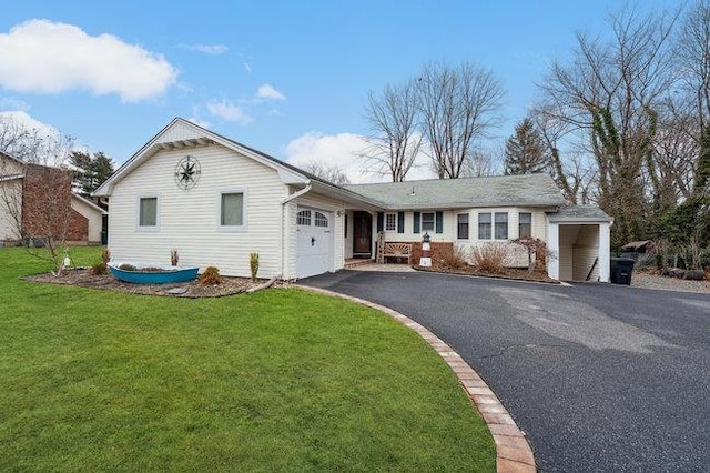 single story home featuring a front yard and a garage