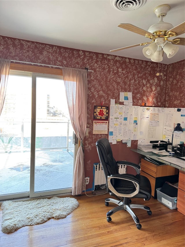 office featuring ceiling fan and wood-type flooring