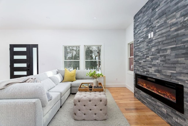 living room featuring a fireplace and light hardwood / wood-style floors