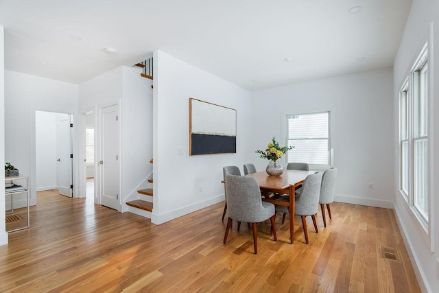 dining area featuring light wood-type flooring