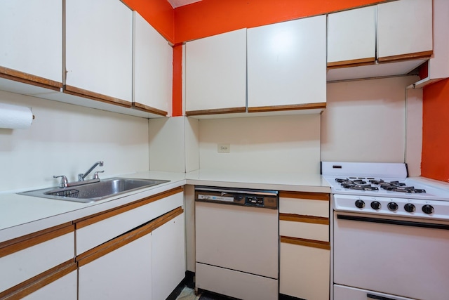 kitchen with white cabinetry, white appliances, and sink