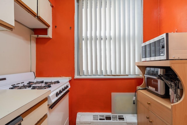 kitchen featuring white gas range oven