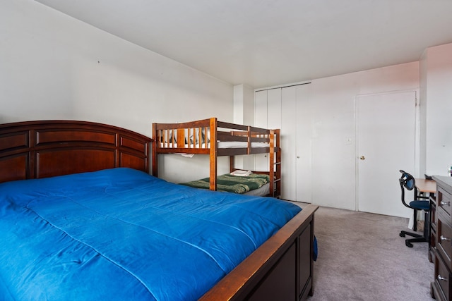 carpeted bedroom with a closet