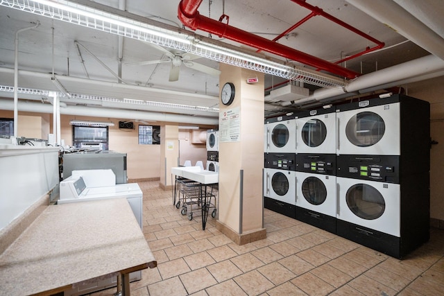 laundry area featuring washing machine and dryer, stacked washer / drying machine, and ceiling fan