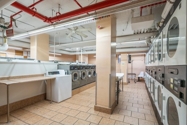 laundry area with stacked washing maching and dryer, washing machine and clothes dryer, and ceiling fan