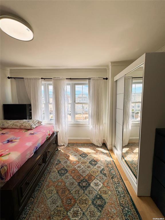 bedroom with light hardwood / wood-style floors