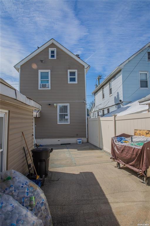 rear view of property featuring a patio area