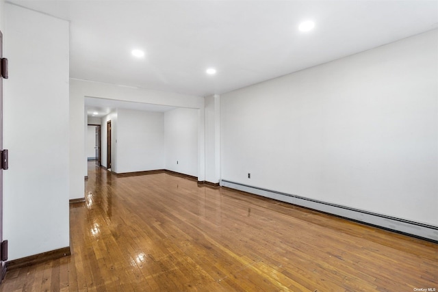 interior space with hardwood / wood-style flooring and a baseboard radiator