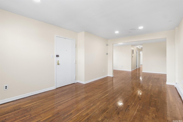 spare room with dark hardwood / wood-style flooring