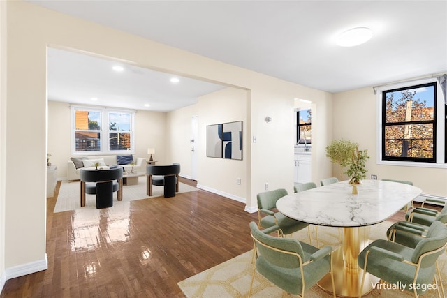 dining space featuring dark hardwood / wood-style flooring