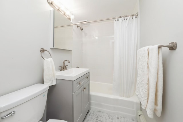 bathroom featuring shower / bath combo, vanity, and toilet