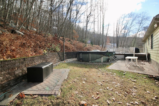 view of yard with a patio and a pool side deck