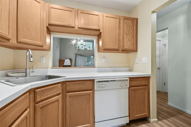 kitchen featuring sink, white dishwasher, a chandelier, light hardwood / wood-style floors, and light brown cabinetry