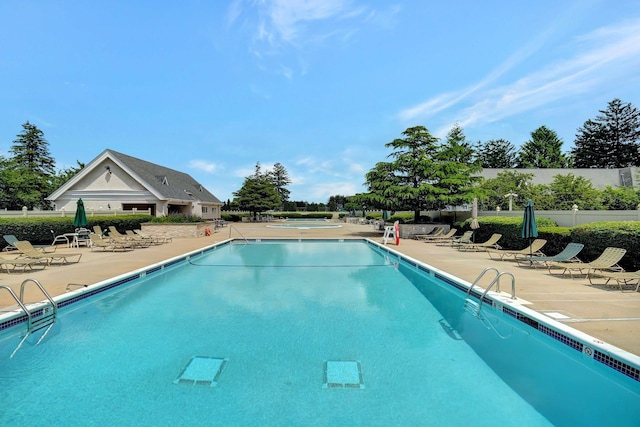 view of swimming pool featuring a patio area