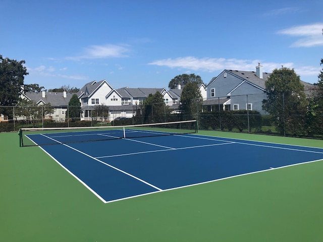 view of tennis court featuring basketball court