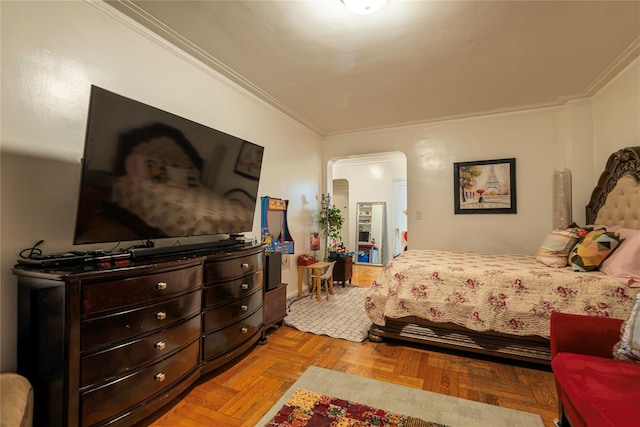 bedroom featuring crown molding and light parquet flooring