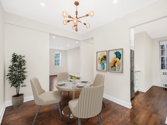 dining area featuring radiator, a notable chandelier, and dark wood-type flooring